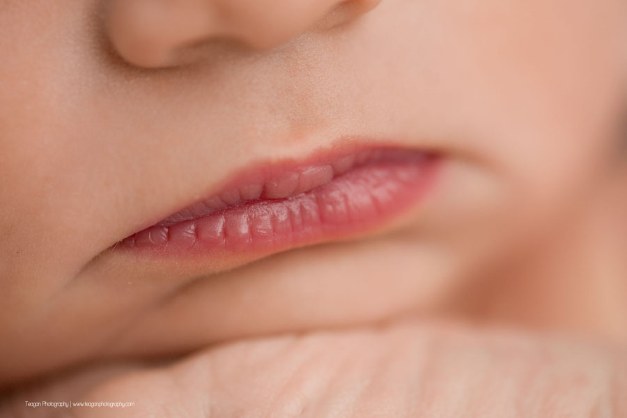 a close up of a newborn baby girl's lips in an Edmonton newborn photo session