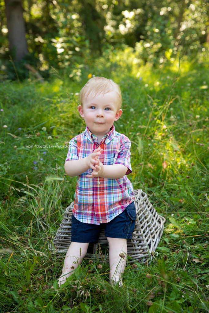 A cute one year boy celebarates his birthday with an outdoor photo shoot