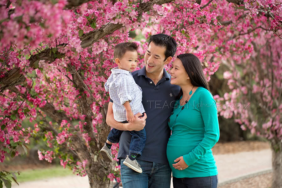Edmonton family photographer capturing outdoor spring maternity photos with children