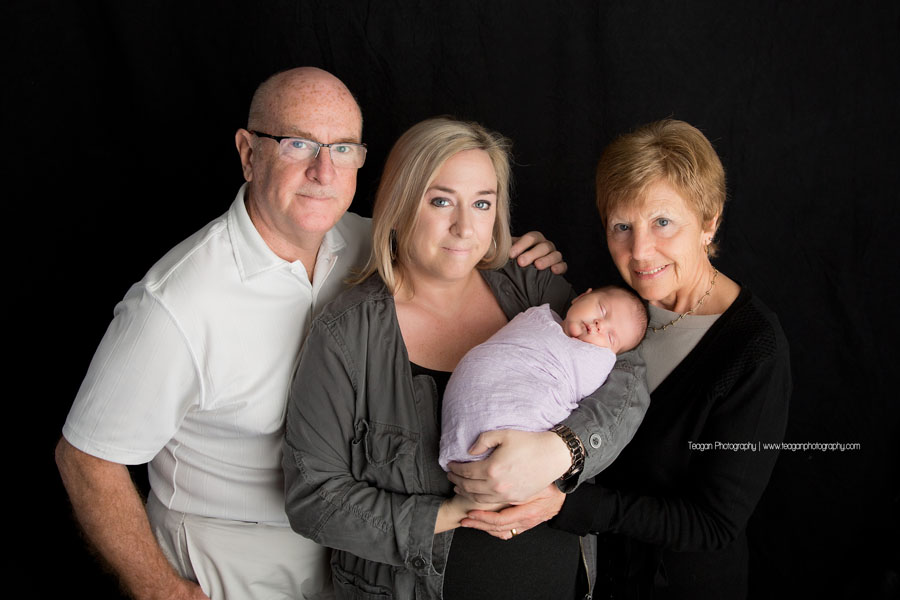 A generational photo taken during an Edmonton newborn photo session in the studio