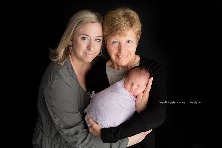 A generational photo taken during an Edmonton newborn photo session in the studio