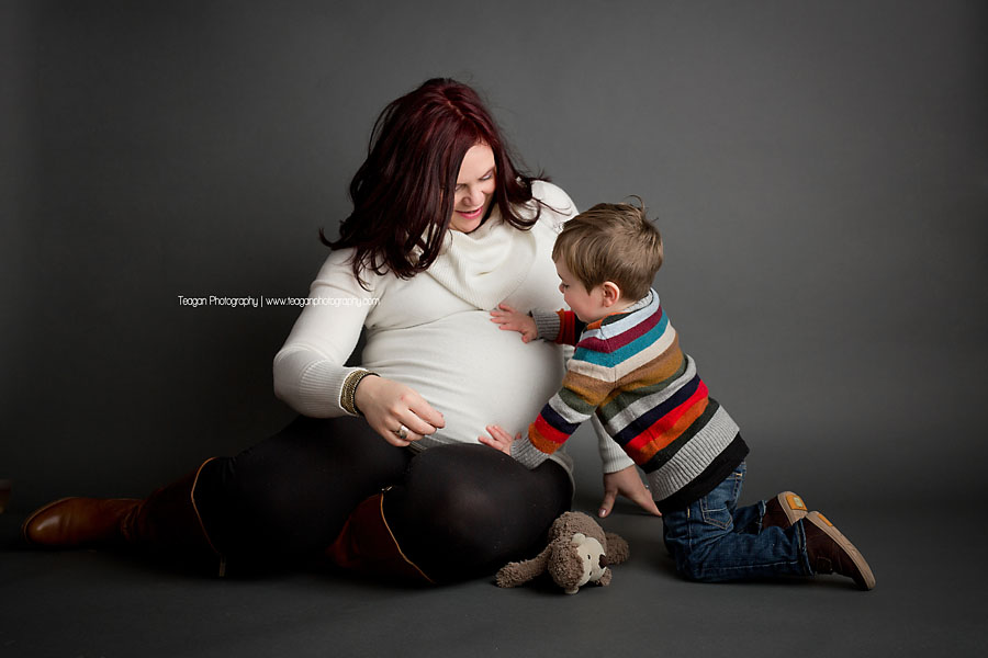 A mother poses with her little boy during maternity photos in Edmonton