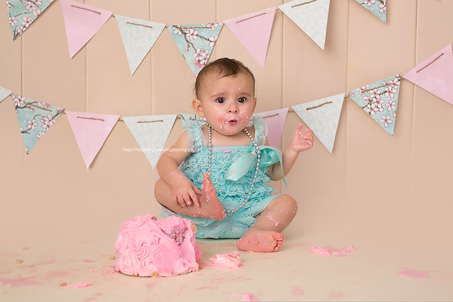 During an Edmonton cake smash photography session the birthday girl does not like her cake