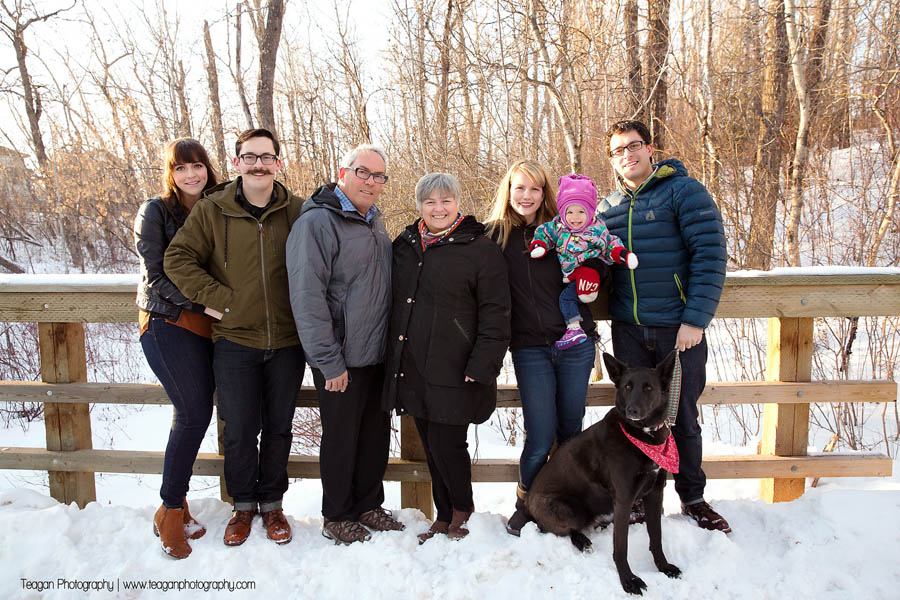 A large family poses together on a snowy path in St Albert