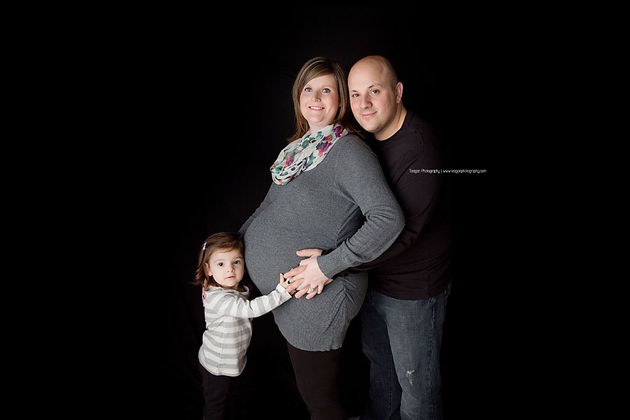 An Edmonton family snuggles together for maternity photos