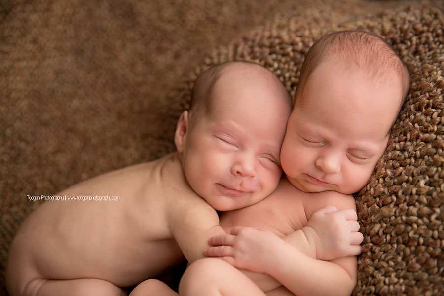 Twin babies  snuggle together during an  Edmonton newborn photography session
