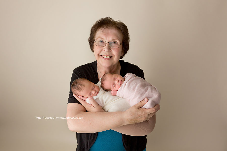 An Edmonton grandmother hugs her twin newborn granddaughters
