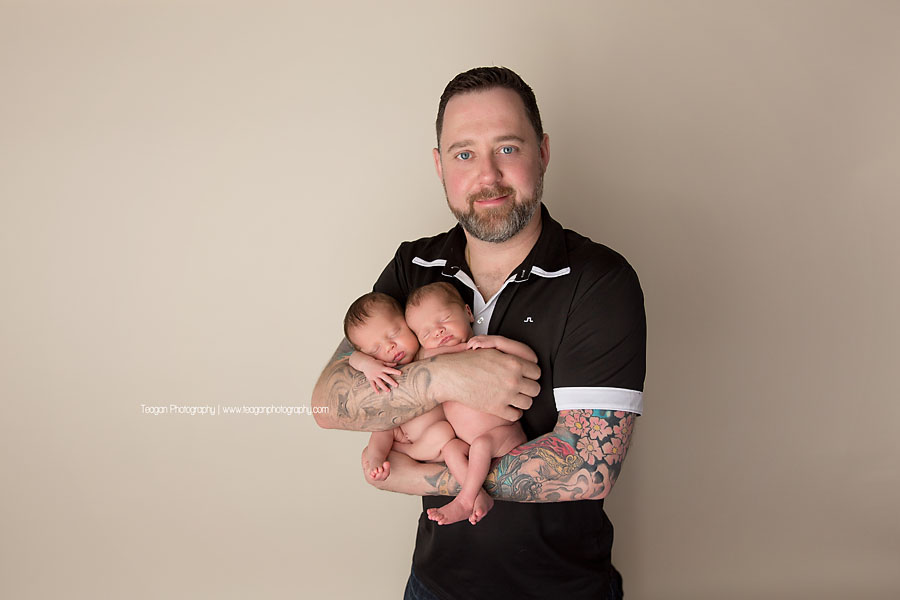 An Edmonton father kisses his twin newborn girls