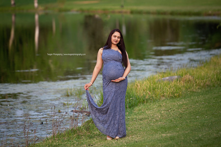 An East Indian woman poses for maternity photos at Hawrelak Park in the Spring.