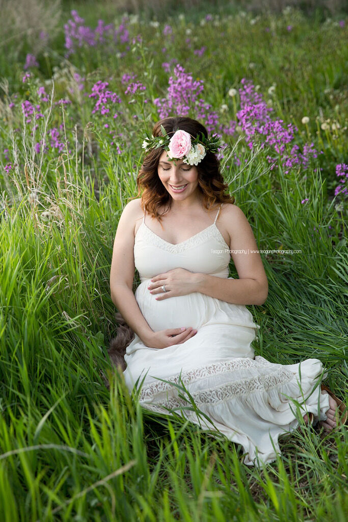 Elegant close-up portrait of a pregnant woman's belly in a beautiful Edmonton park setting