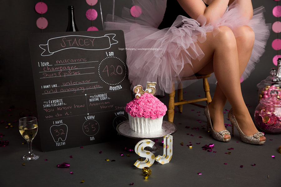 A blonde woman wears a pink tutu and sparkly Louboutin shoes for an adult cake smash in Edmonton
