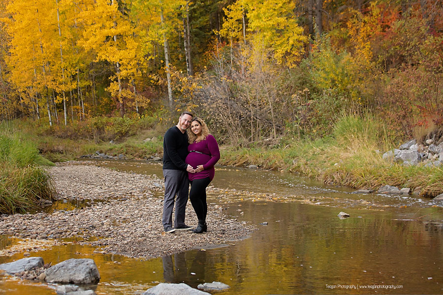 YEG family photographer capturing outdoor fall maternity photos with orange and yellow foliage