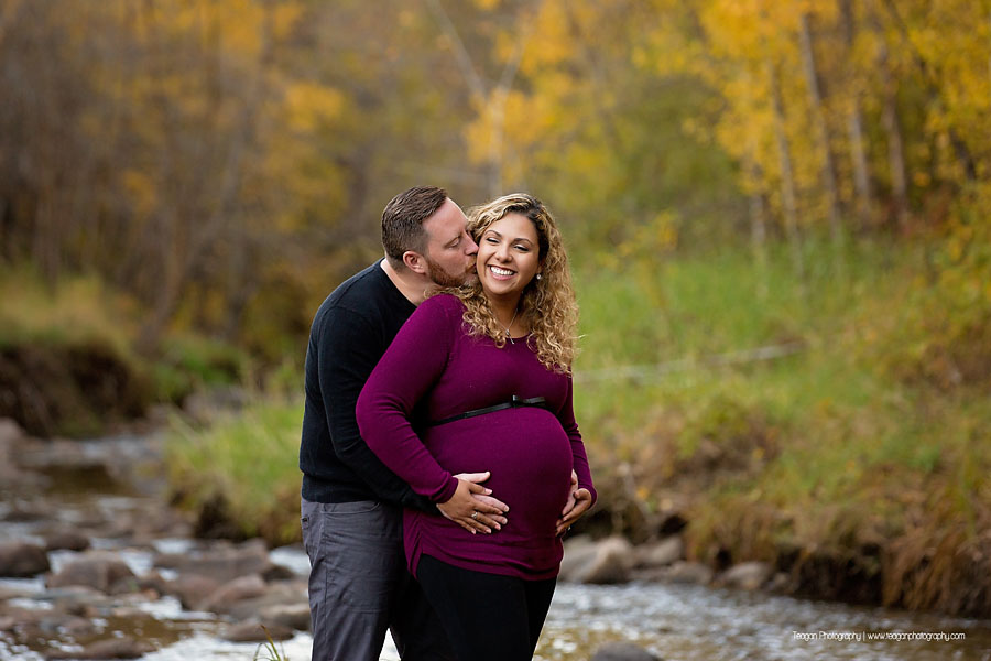 YEG family photographer capturing outdoor fall maternity photos with orange and yellow foliage