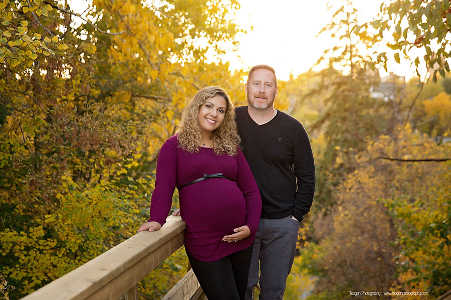 YEG family photographer capturing outdoor fall maternity photos with orange and yellow foliage